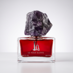 Sweet Addiction Eau de Parfum bottle by Le Vogh with purple gemstone cap